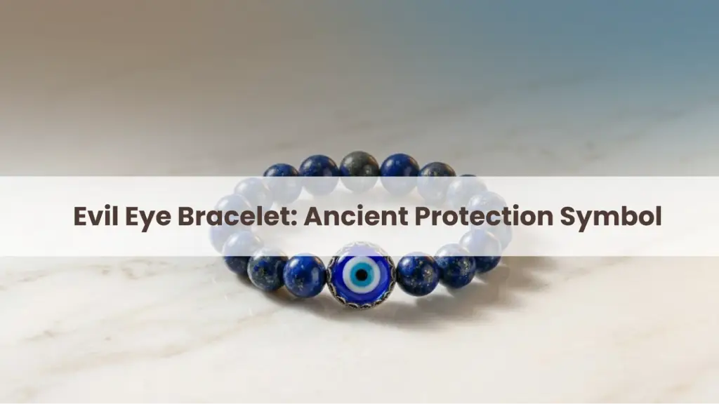 Blue evil eye bracelet on a light marble surface with the text “Evil Eye Bracelet: Ancient Protection Symbol.